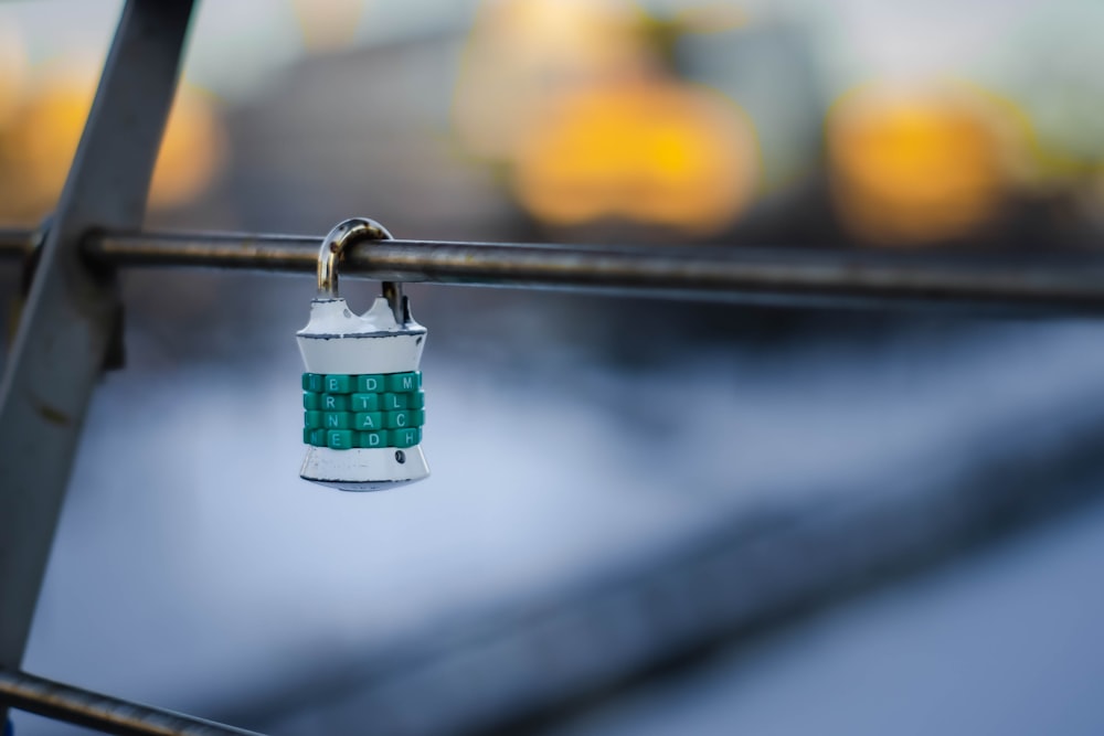 a close up of a padlock on a fence