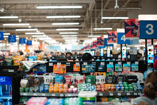 Modern supermarket customer service desk with friendly staff ready to assist.