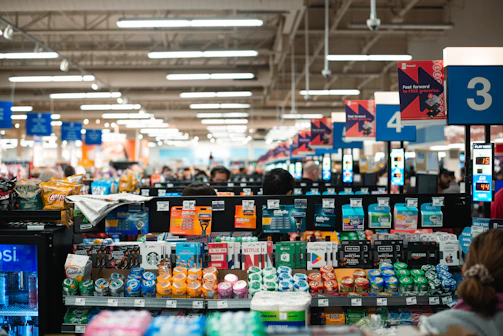 Modern supermarket customer service desk with friendly staff ready to assist.