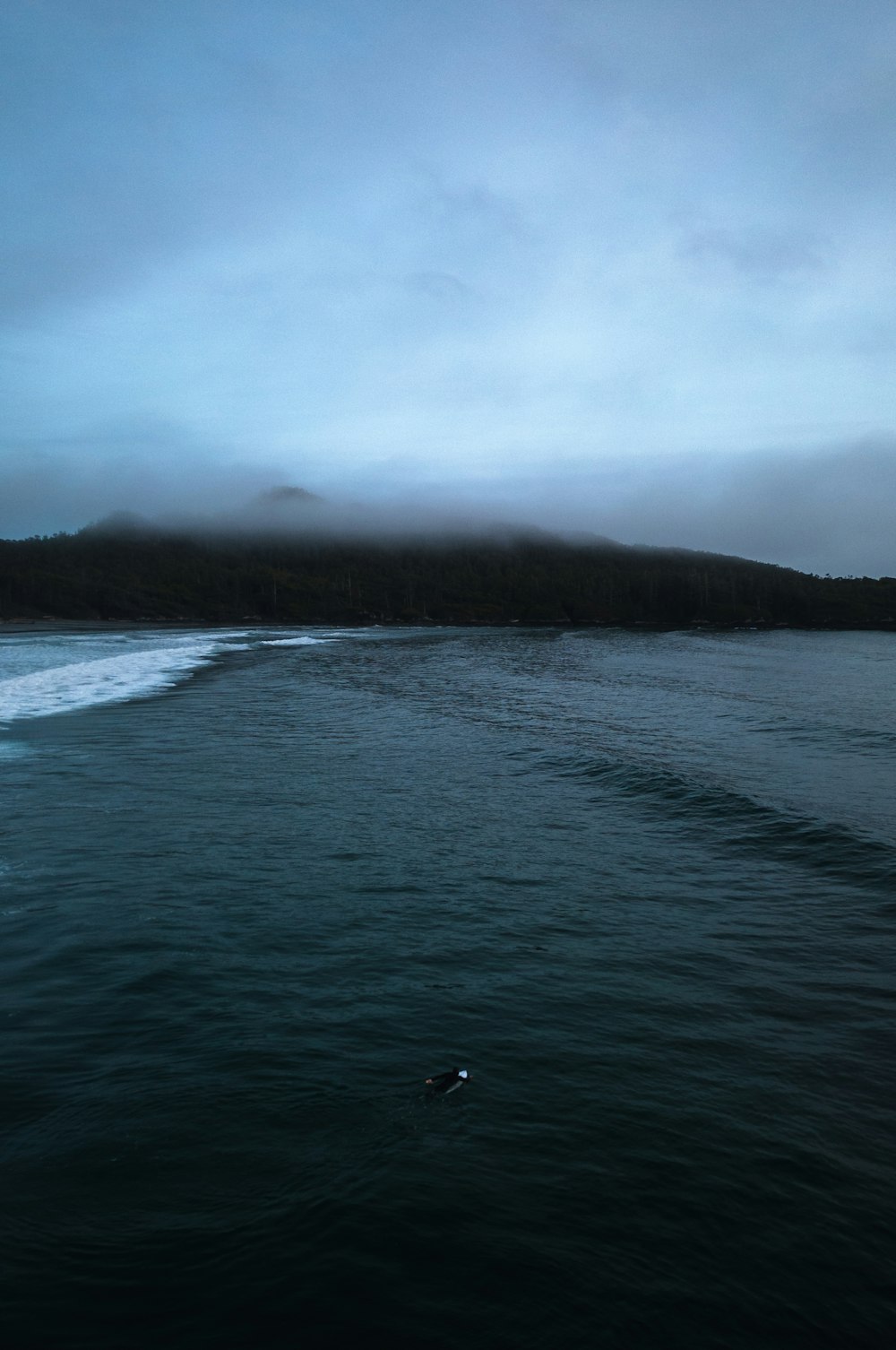 a body of water with a boat in the distance