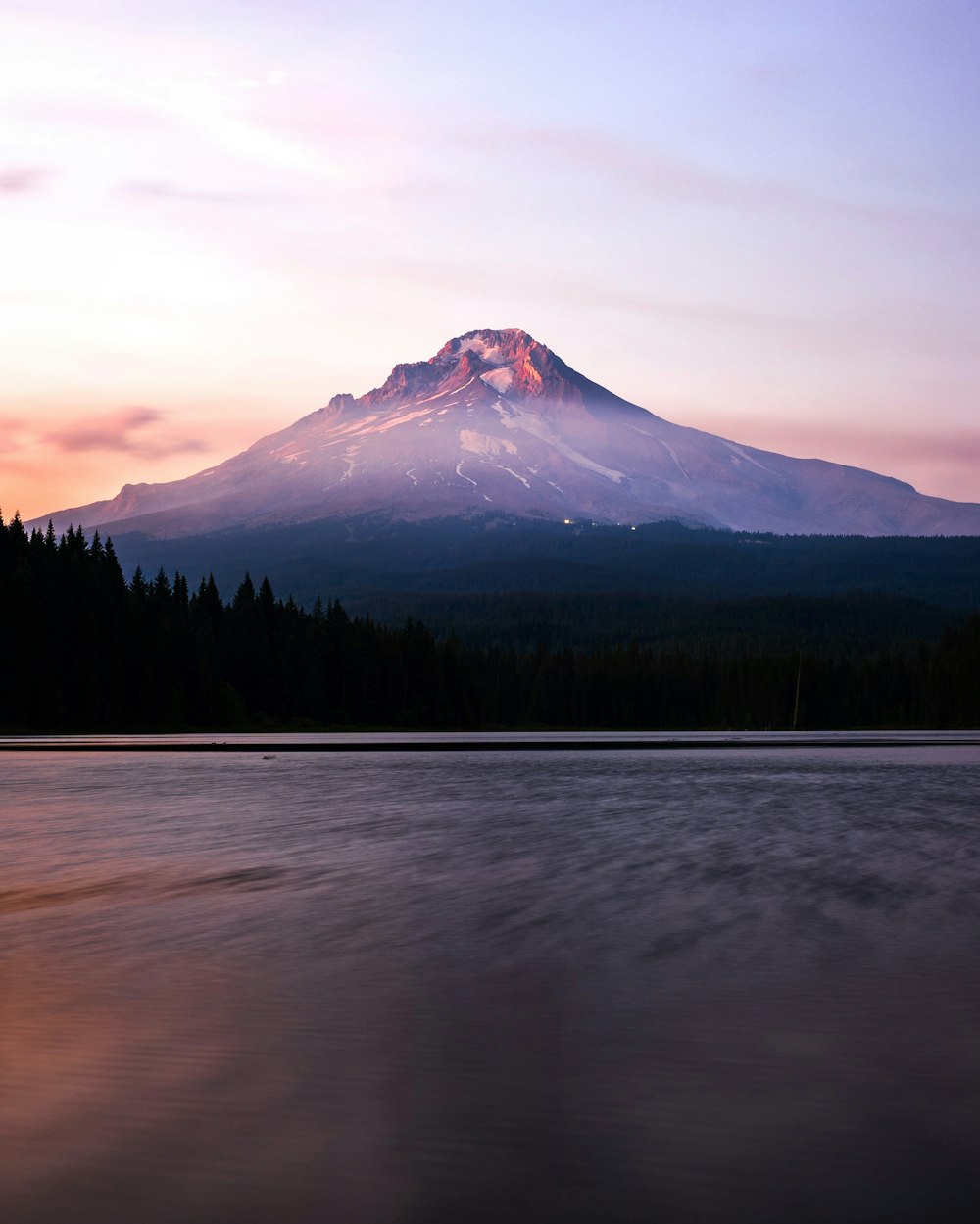 a view of a mountain with a lake in front of it