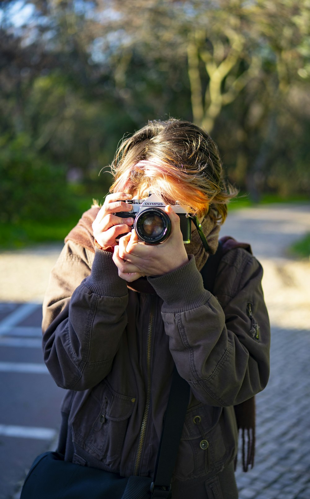 a woman taking a picture with a camera