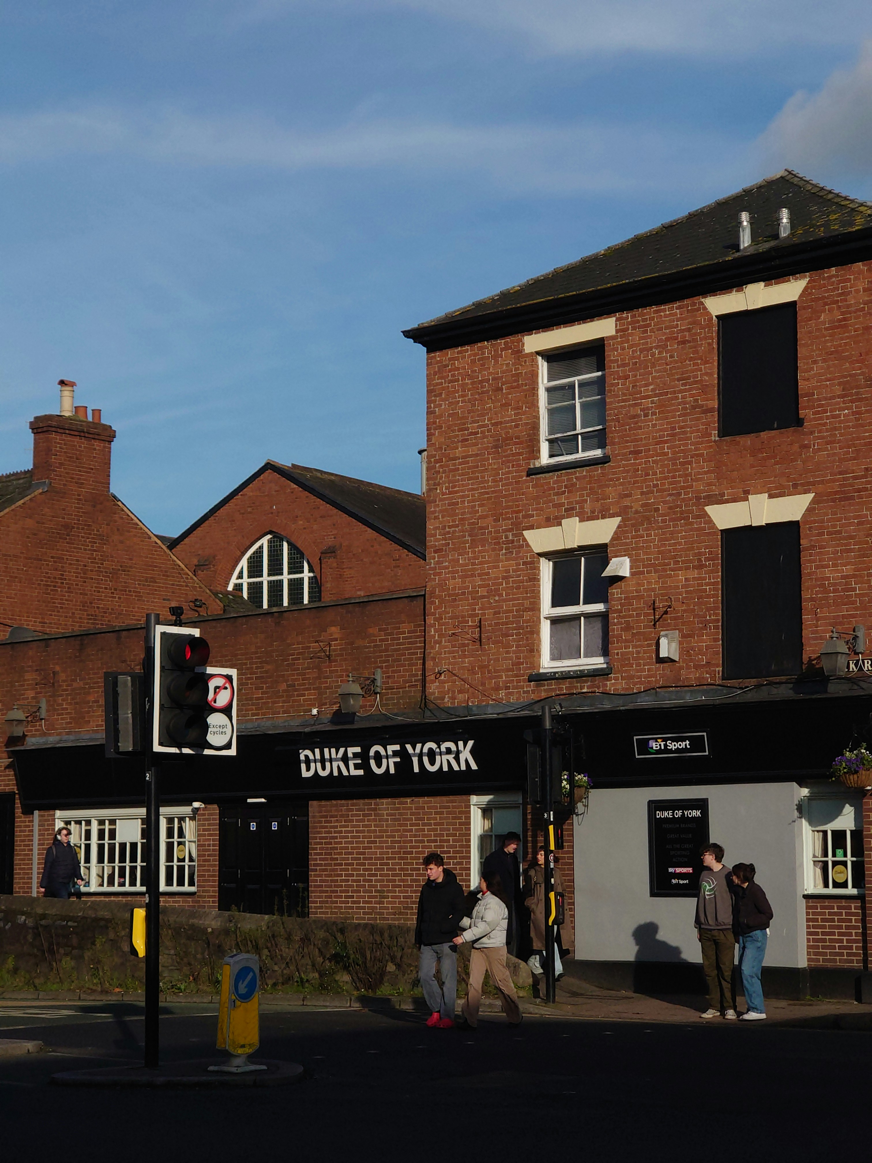 a group of people standing outside of a building