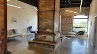 Industrial chic office space in Aurangabad with exposed brick walls and sleek metal fixtures.