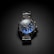 A metallic wristwatch with a dark face featuring large numerals and three small dials for additional functions. The watch has a sturdy metal bracelet, and the face has a blue tint.