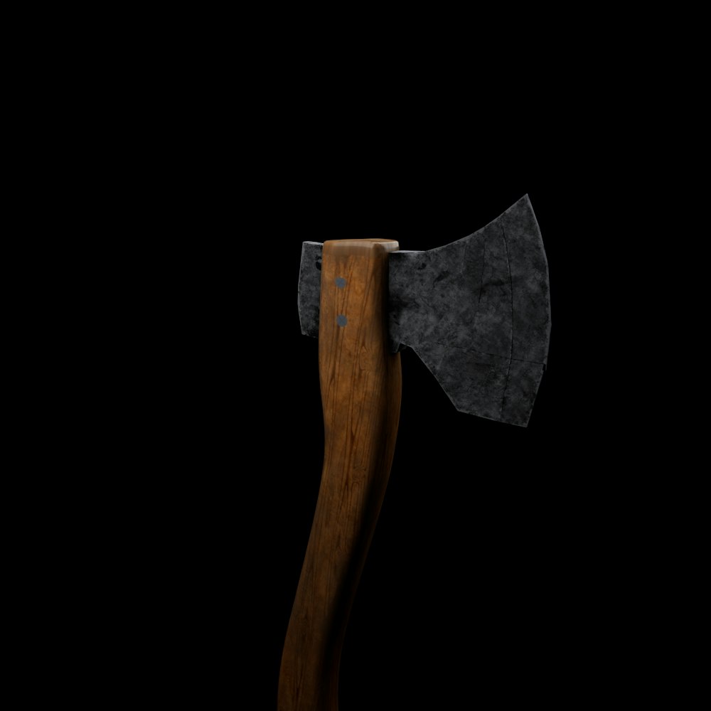 an old axe with a wooden handle on a black background