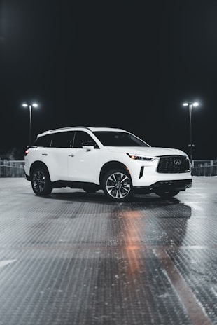 A sparkling SUV parked outside with no visible dents, showcasing expert paintless dent repair.