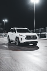 A sparkling clean SUV parked outside a shopping mall after a wash.