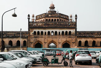 A sturdy Innova parked outside a popular landmark in Raipur at sunset.
