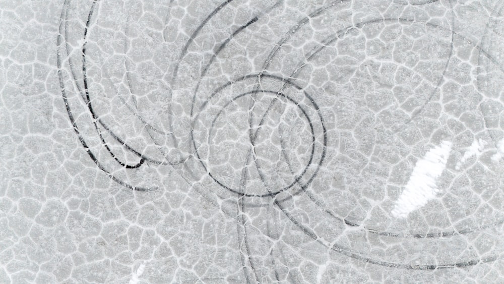 a drawing of a circular object on a white surface