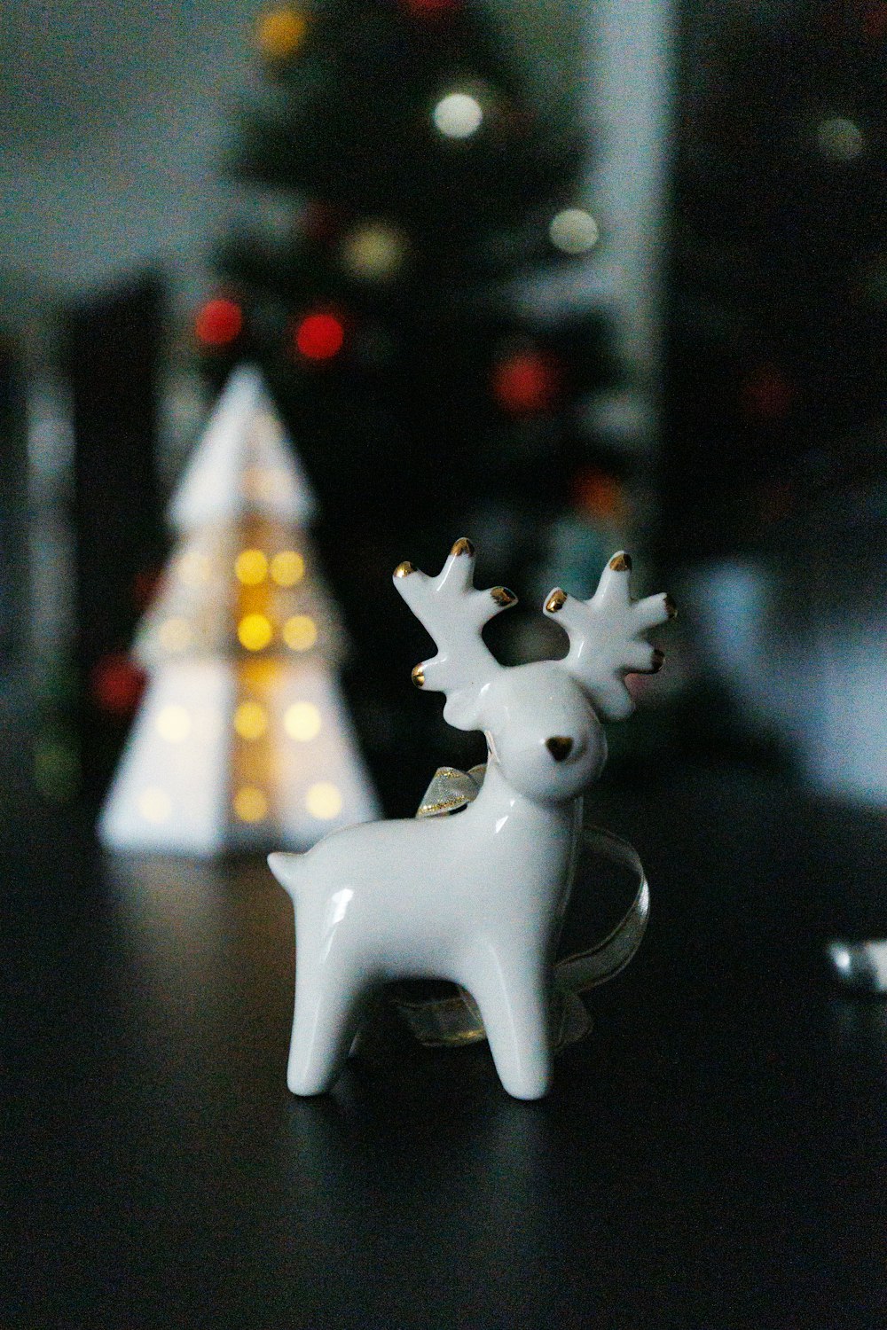 a white reindeer figurine sitting on top of a table