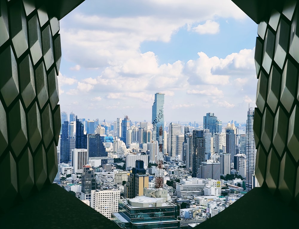 a view of a city from a window in a building