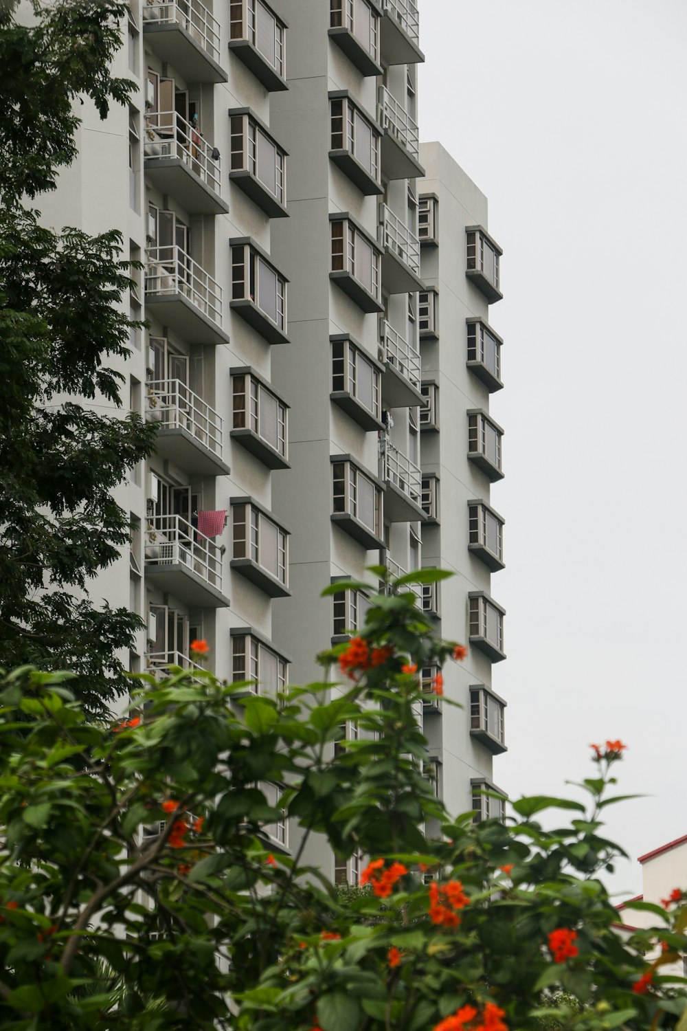 a tall building with balconies and balconies on the top of it