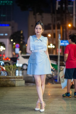 photography poses for women,how to photograph portrait of asian young girl posing night outdoors, light of urban, handmade fashion; a woman walking down a street at night