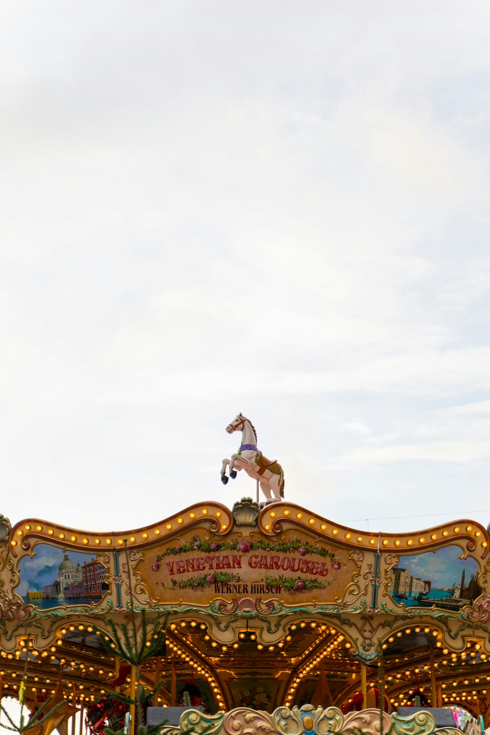 a merry go round with a horse on top of it