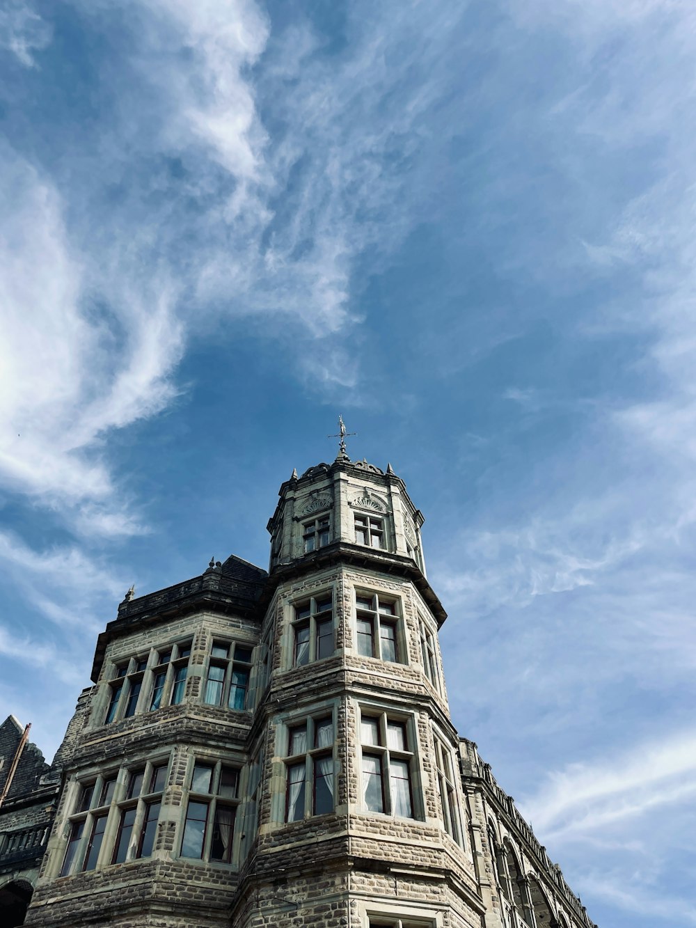 a tall building with a clock on the top of it