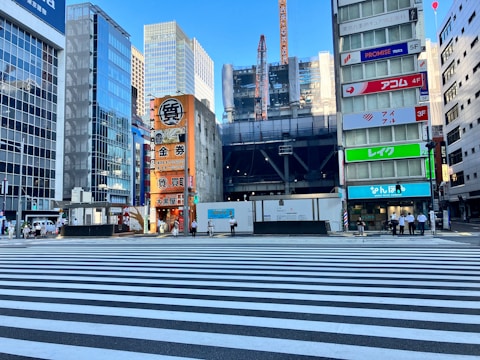 A bustling commercial complex with glass facades and active construction.