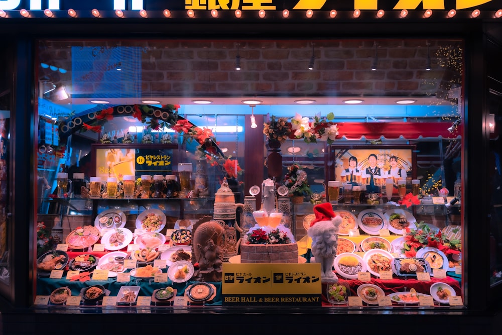 a store front window with a display of dishes