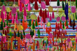 Elegant tassel-themed sangeet setup with colorful hanging tassels creating a playful backdrop.