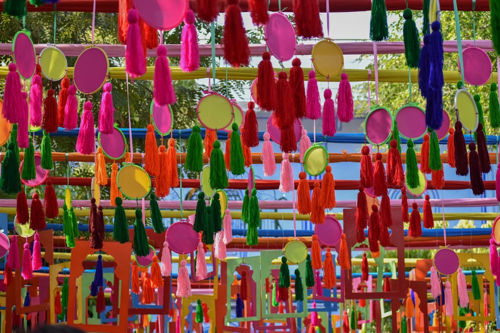 a group of colorful objects hanging from a ceiling