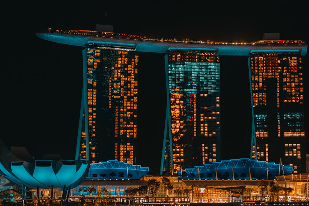 a very tall building with a lot of lights on it,