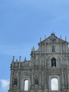 Historic church facade with intricate stone carvings in Palencia.