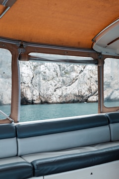 Close-up of a freshly upholstered boat seat with navy blue marine canvas.