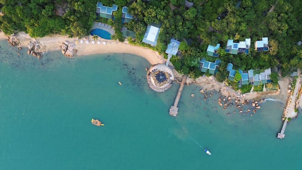 a bird's eye view of a beach with a dock