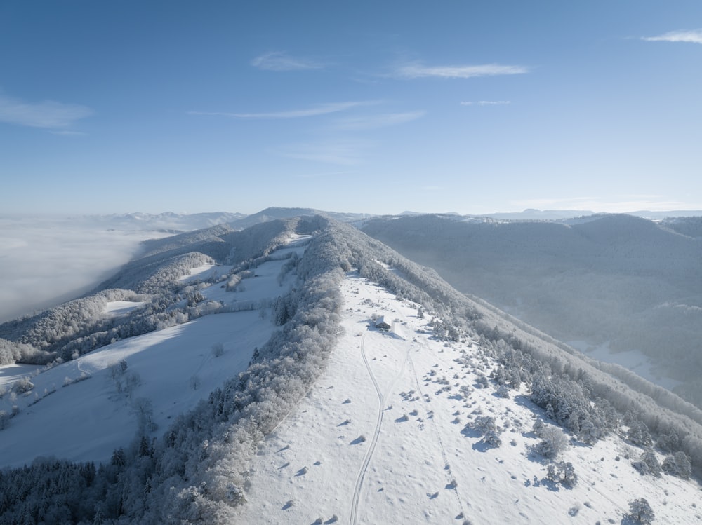 a view of a snow covered mountain from a plane