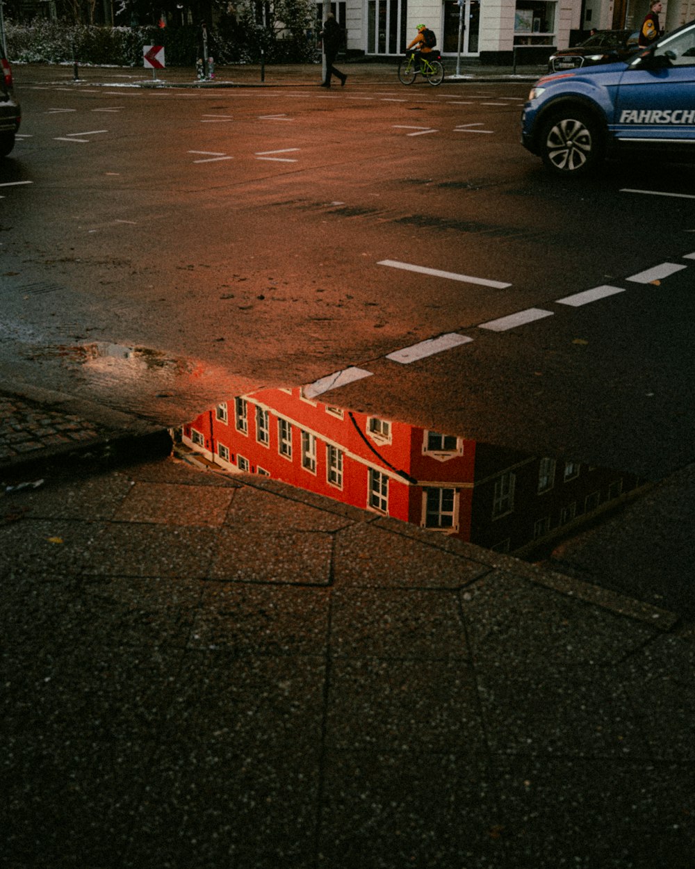 a red building sitting on the side of a road