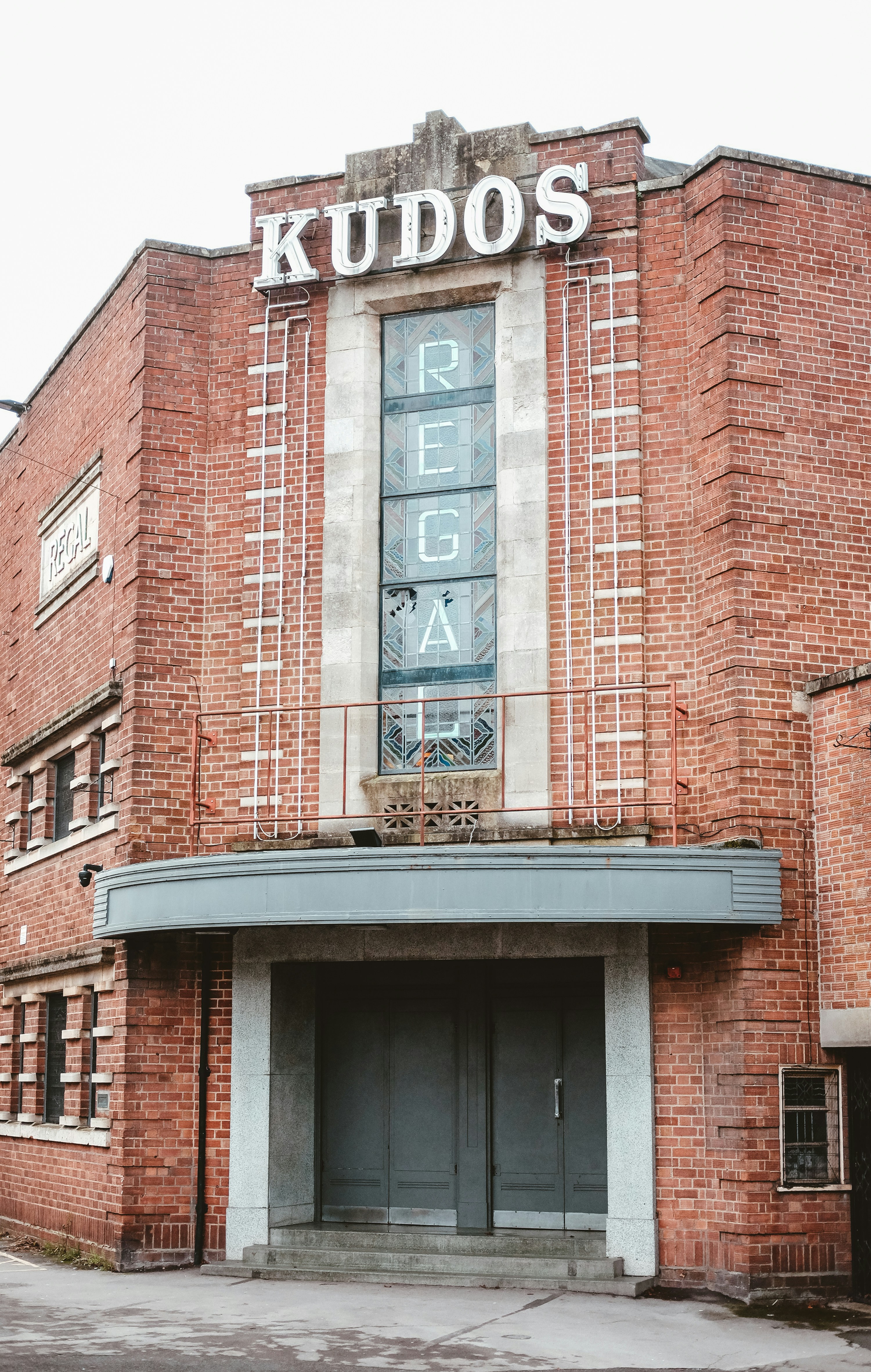 a large brick building with a sign on top of it