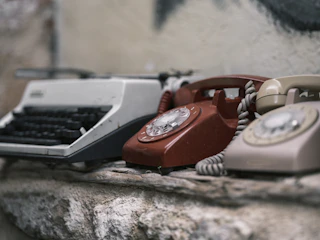 Modern telephone and communication devices on display.