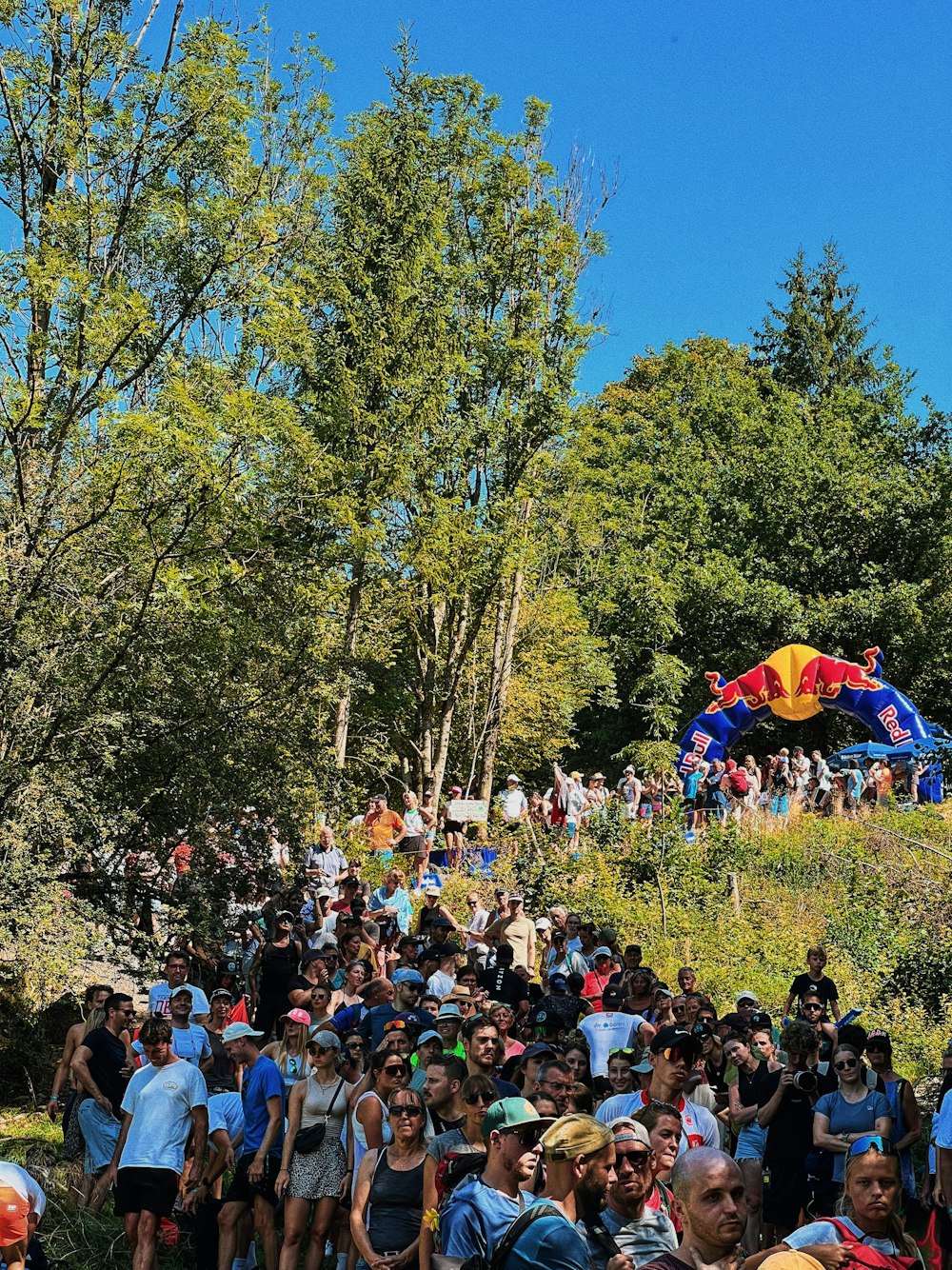 a large group of people walking up a hill