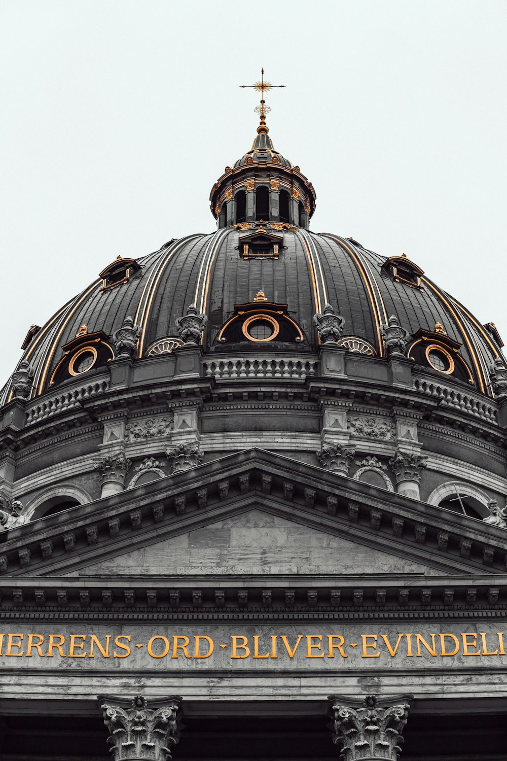 a large dome with a cross on top of it