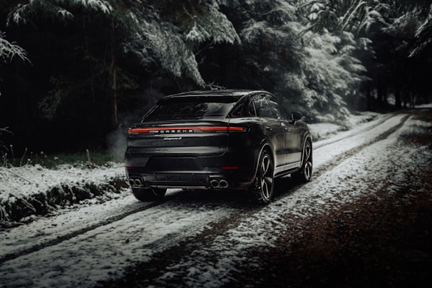 Spacious black SUV ready for a weekend adventure on a forest road