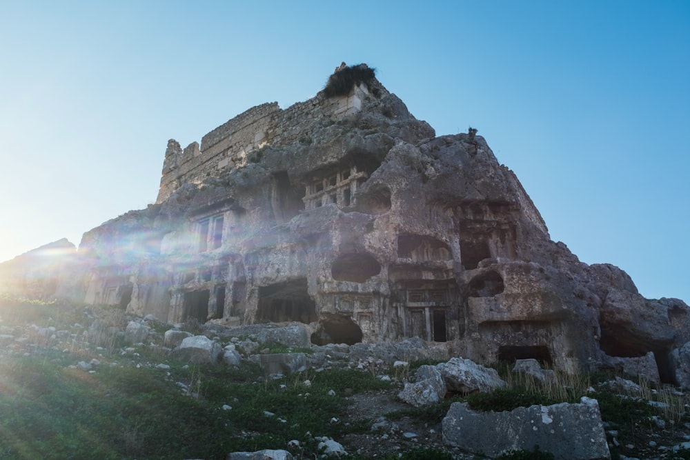 the sun shines brightly on the ruins of a building