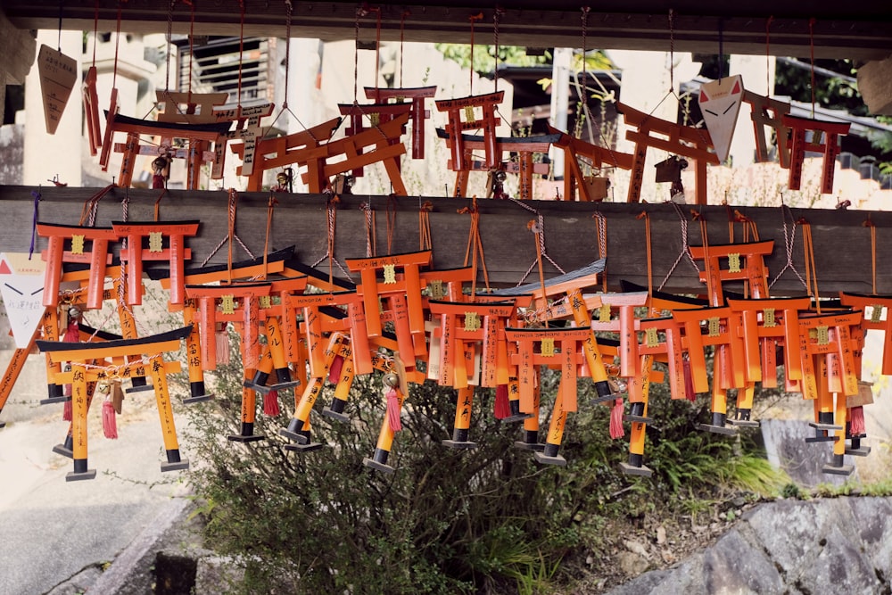 a bunch of orange chairs sitting on top of a hill