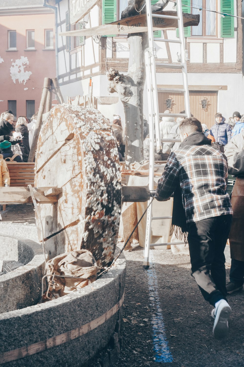 a group of people standing around a fountain