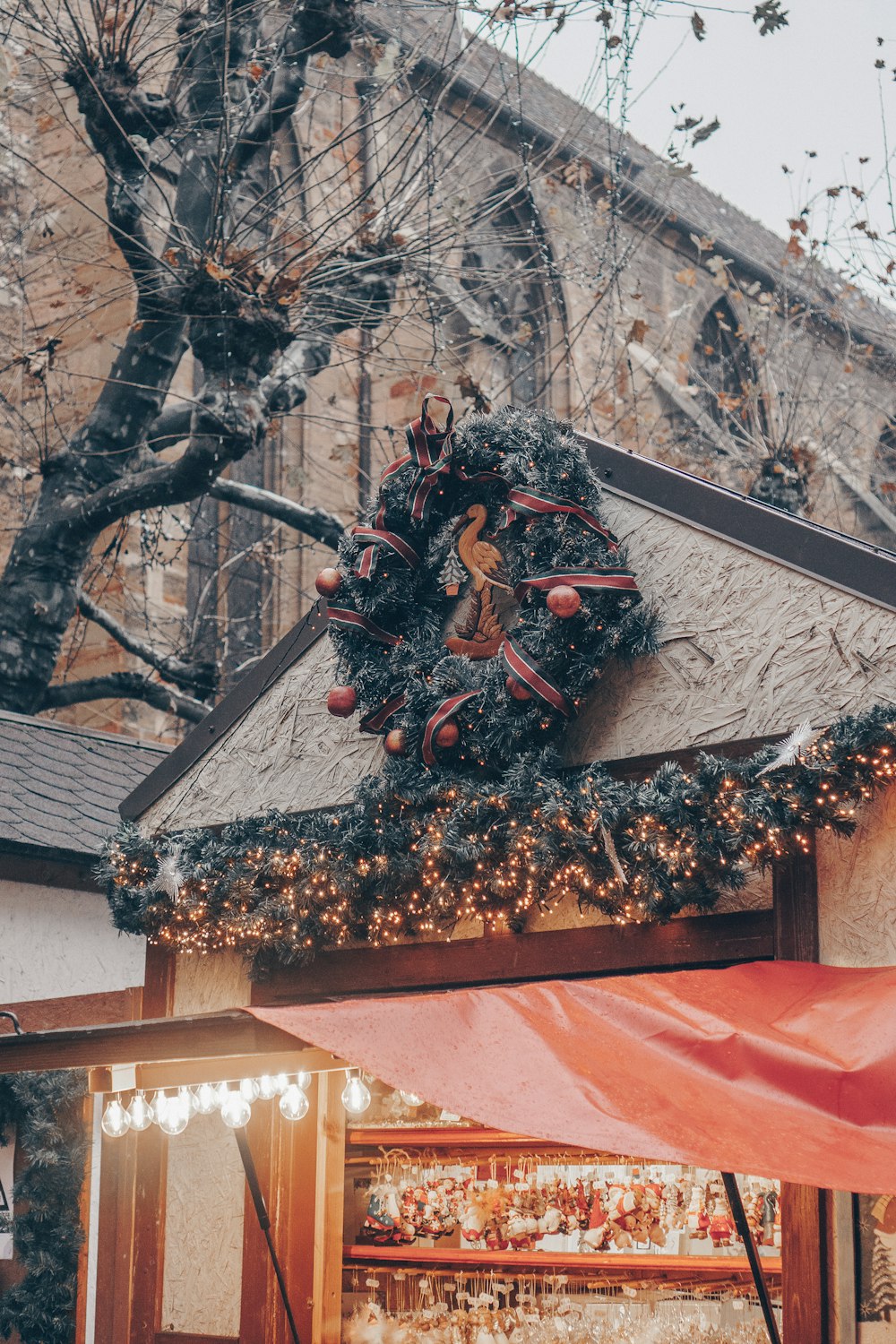 a christmas wreath on the roof of a building