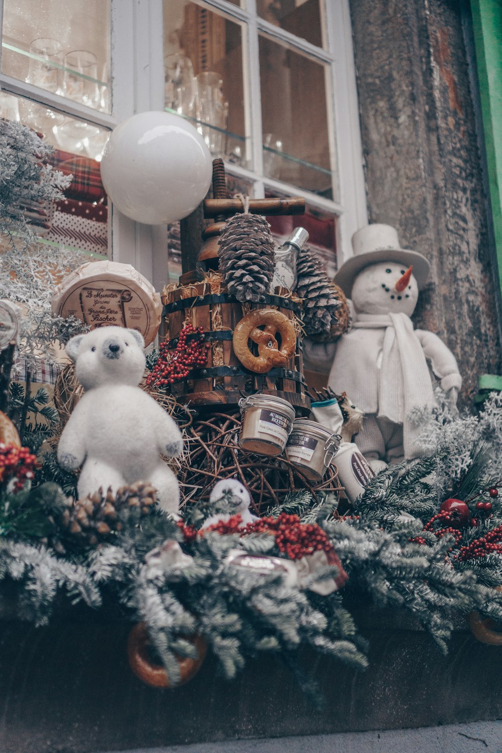 a window display with teddy bears and christmas decorations