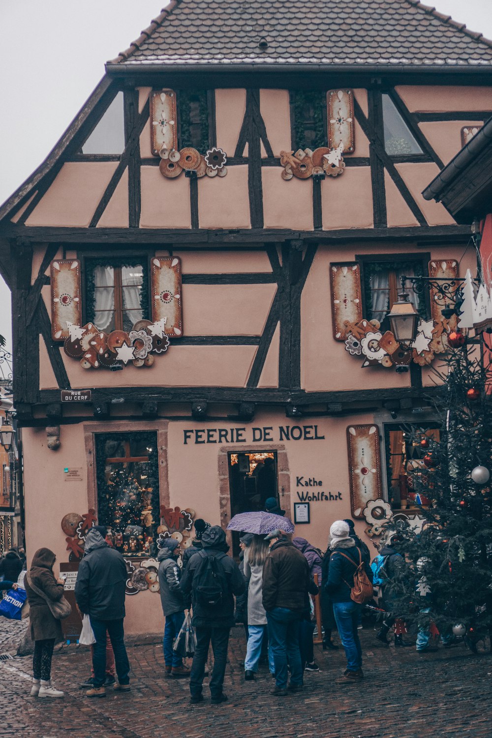 a group of people standing in front of a building