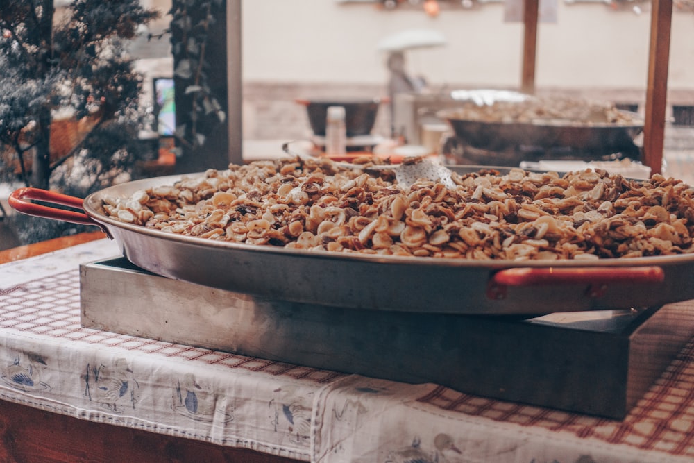 a large pan of food sitting on top of a table