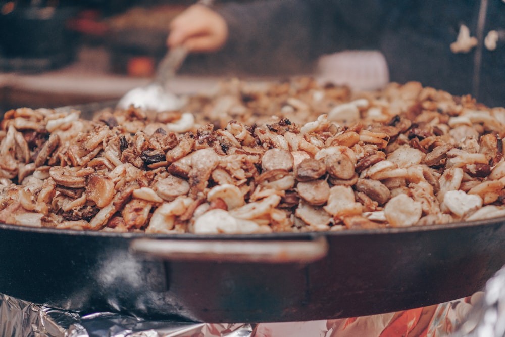 a pan filled with food sitting on top of a stove