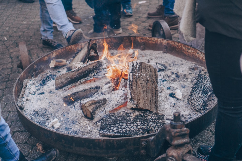 a fire pit with a bunch of logs in it