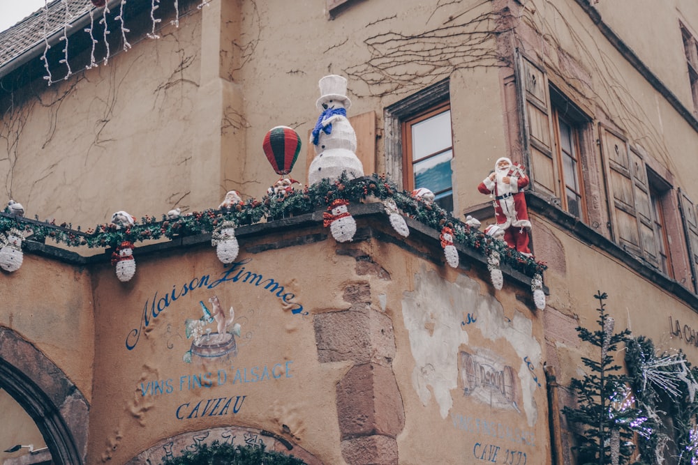 a building with christmas decorations on the top of it