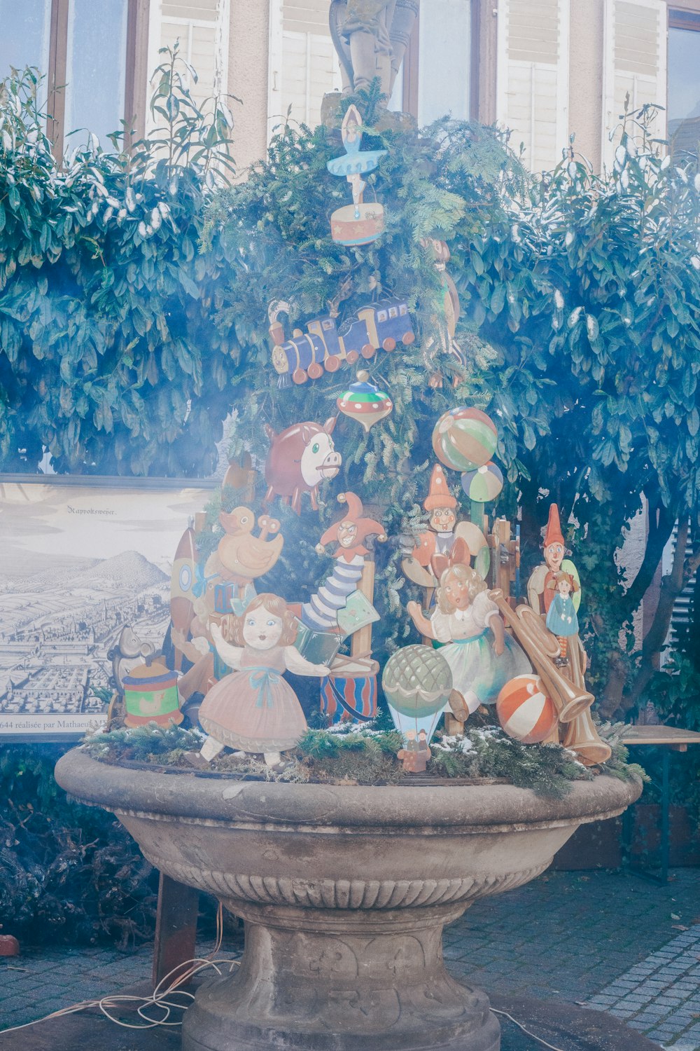 a fountain with a bunch of figurines on it