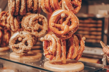 A cozy pickup counter with wooden accents and soft lighting, showcasing freshly baked pretzels.