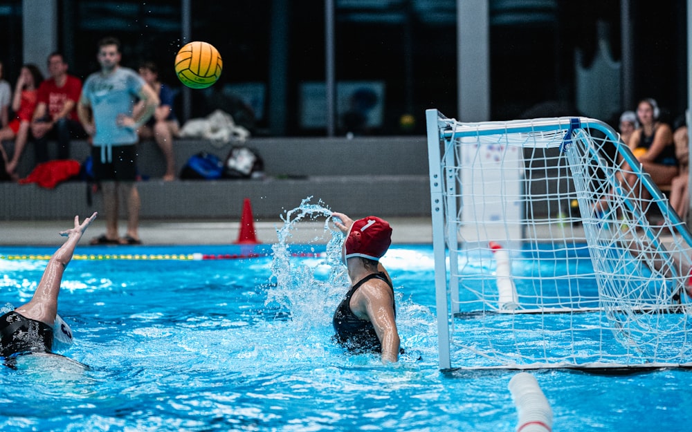 a group of people playing a game of water polo