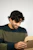 Happy man unboxing a package with excitement