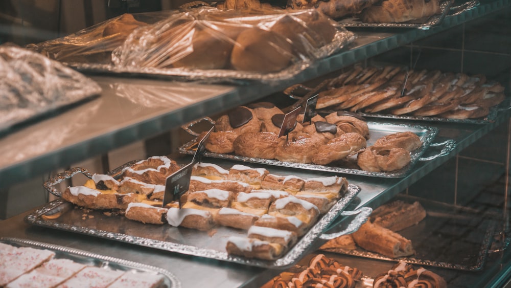 a display case filled with lots of different types of pastries